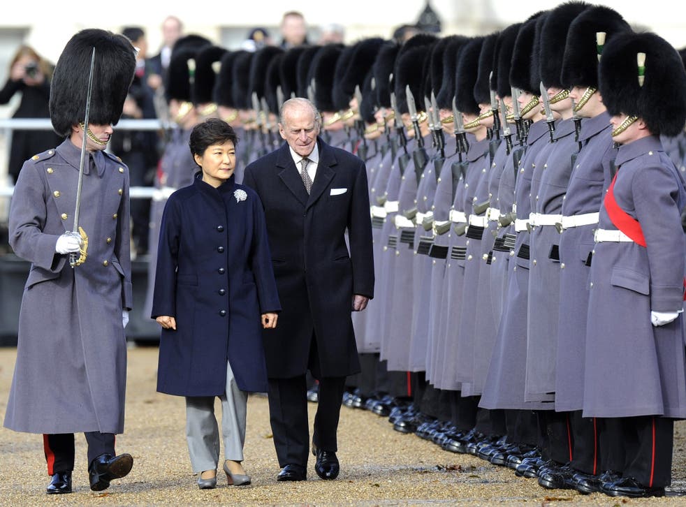 South Korean President Park Geun-hye is accompanied by Prince Philip at Horse Guards Parade in London