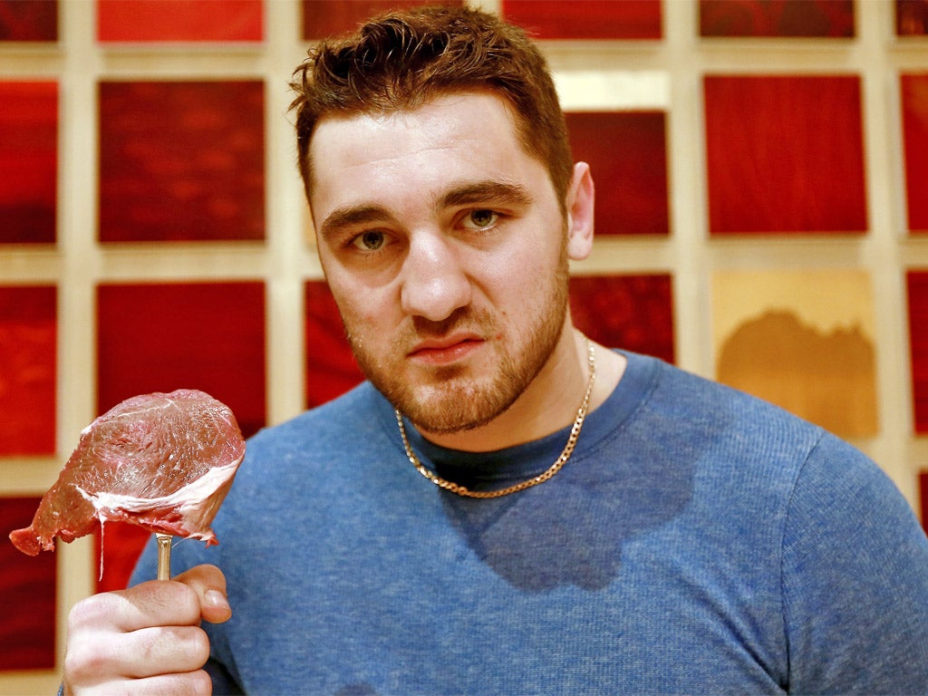 Nathan Cleverly poses with a piece of meat to illustrate his step up to cruiserweight