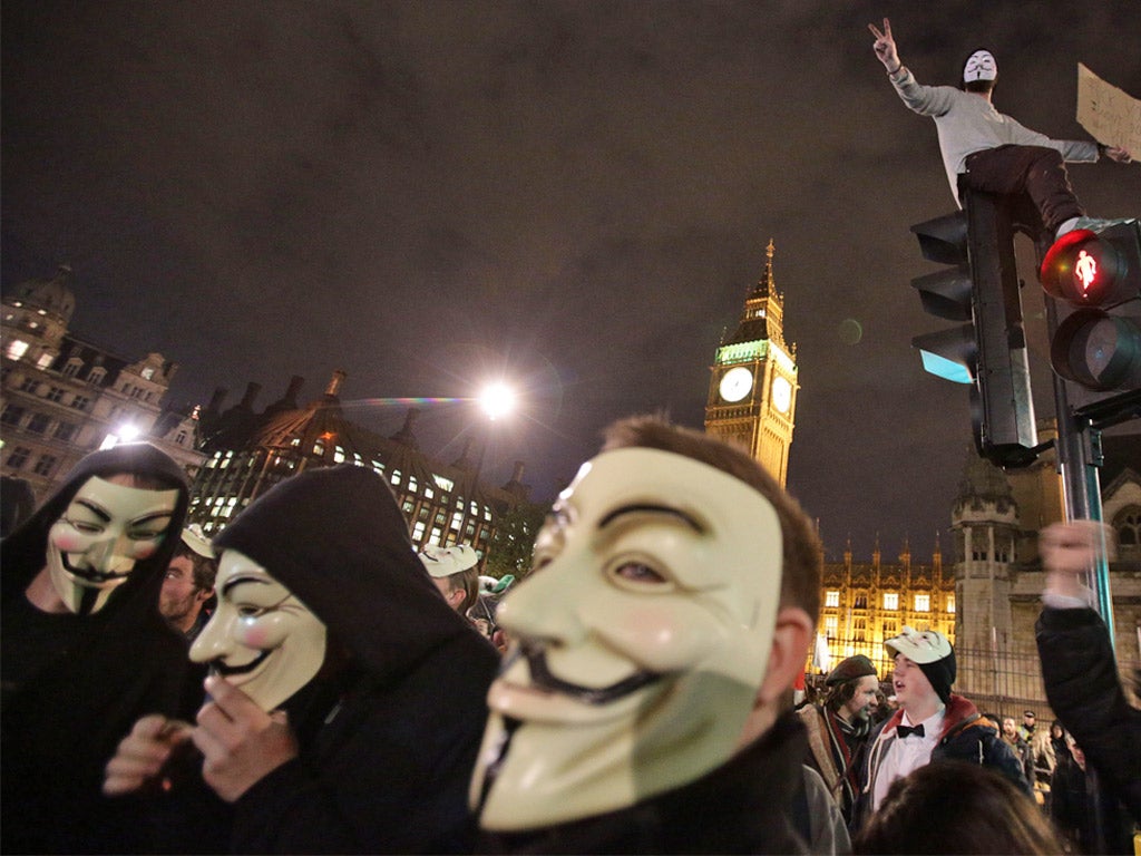 Protesters demonstrate as part of the Bonfire of Austerity protest outside the Houses of Parliament