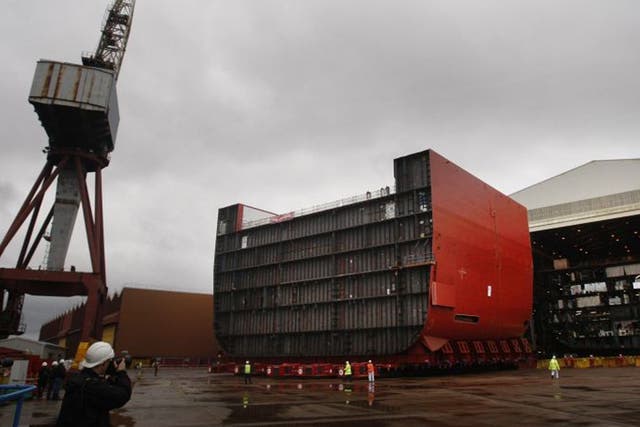 A section of the hull of HMS Queen Elizabeth being moved at BAE Systems' Govan Shipyard in Glasgow, Scotland, where jobs are under threat