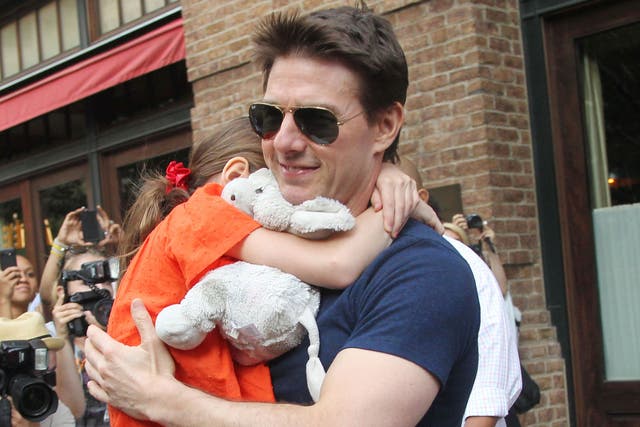 Tom Cruise has settled a $50million defamation lawsuit against a German media company that claimed he had “abandoned” his daughter Suri after his divorce from actress Katie Holmes. 