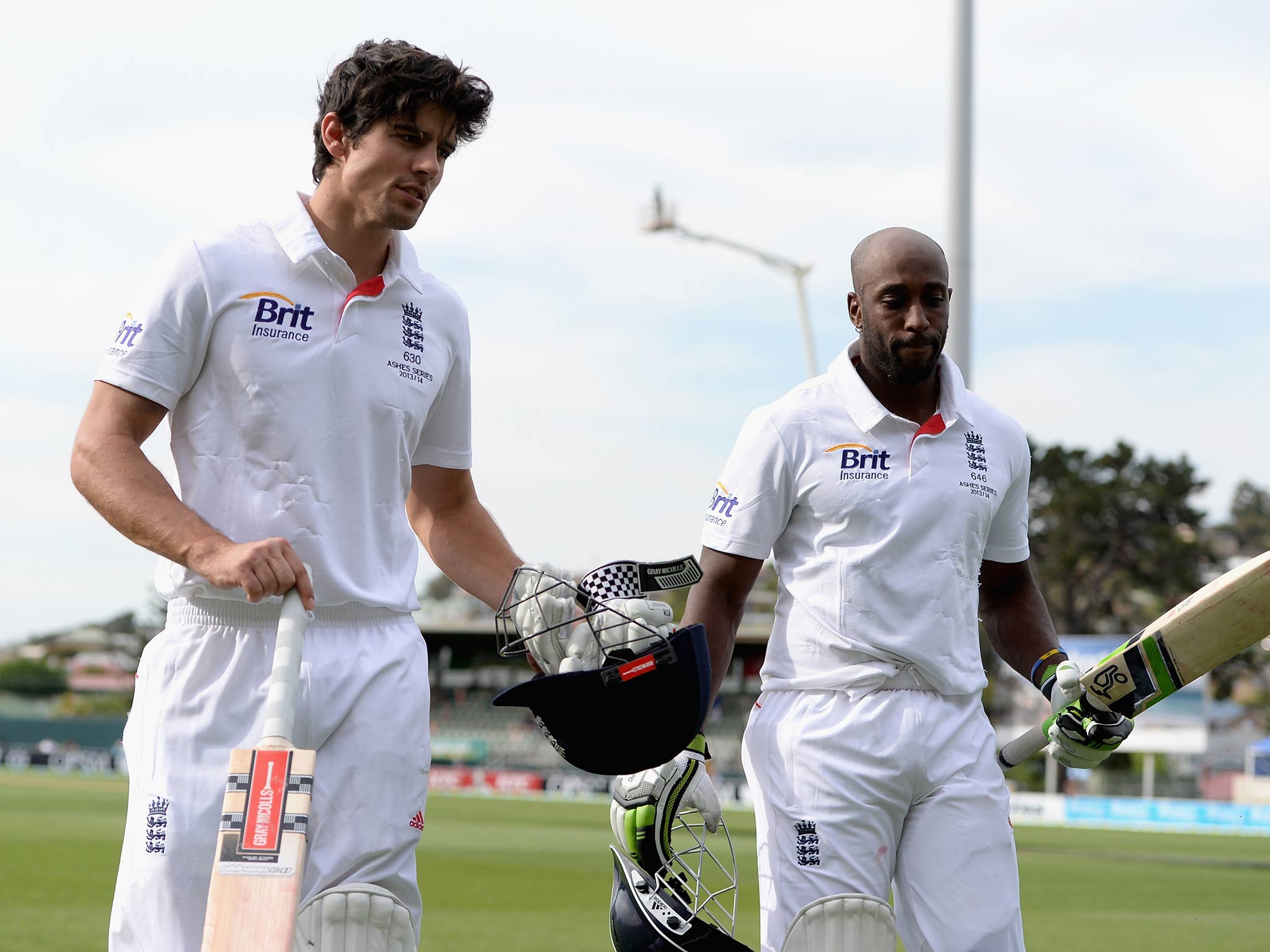 England captain Alastair Cook and Michael Carberry salute the crowd as they leave the field at the end of day one of the tour match between Australia A and England