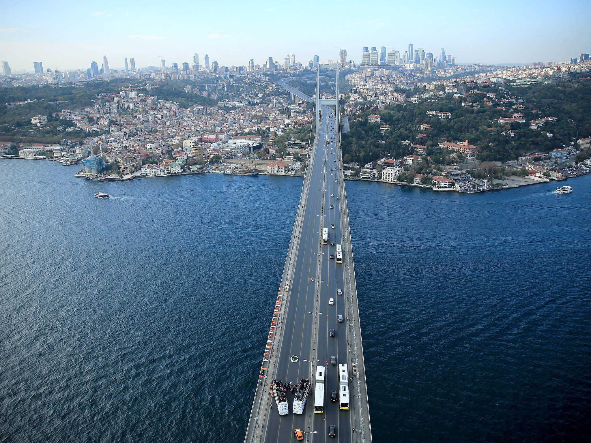 Tiger Woods makes history as he hits the first golf shots from East to West on Istanbul's iconic Bosphorus Bridge