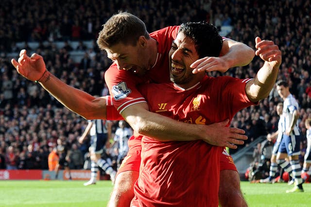 Steven Gerrard is hoping success this season will convince Luis Suarez to stay with Liverpool