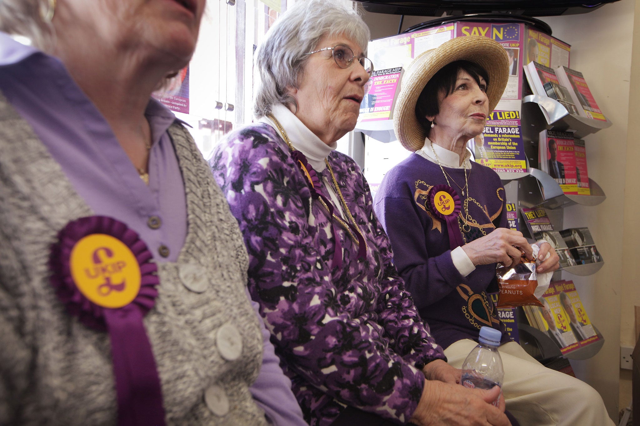 Ukip members await the arrival of their leader, Nigel Farage, at the party's campaign headquarters in Buckingham