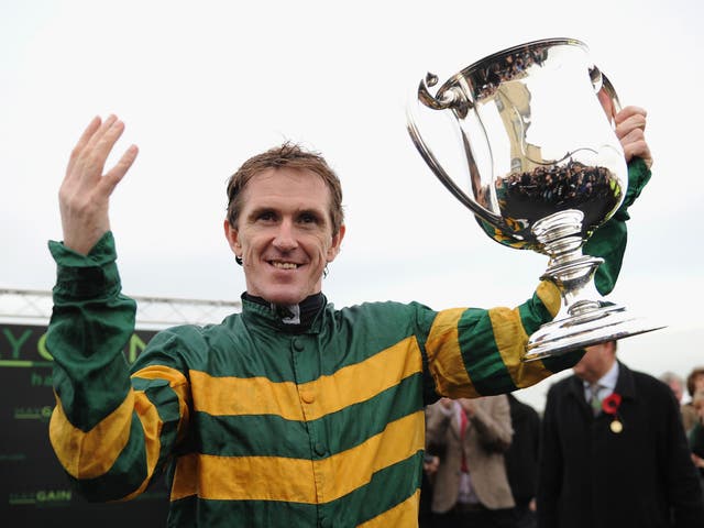 Tony McCoy celebrates riding his 4,000th winner after taking victory on Mountain Tunes at Towcester