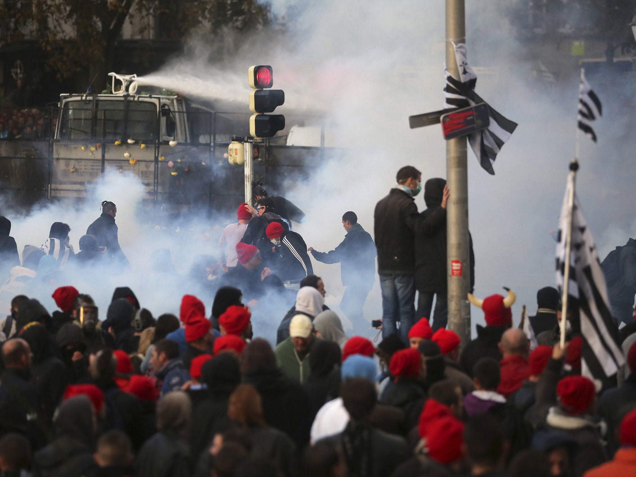 Breton 'red-bonnet' protesters show their anger at lay-offs and rising taxes, a feeling that is fast spreading across France