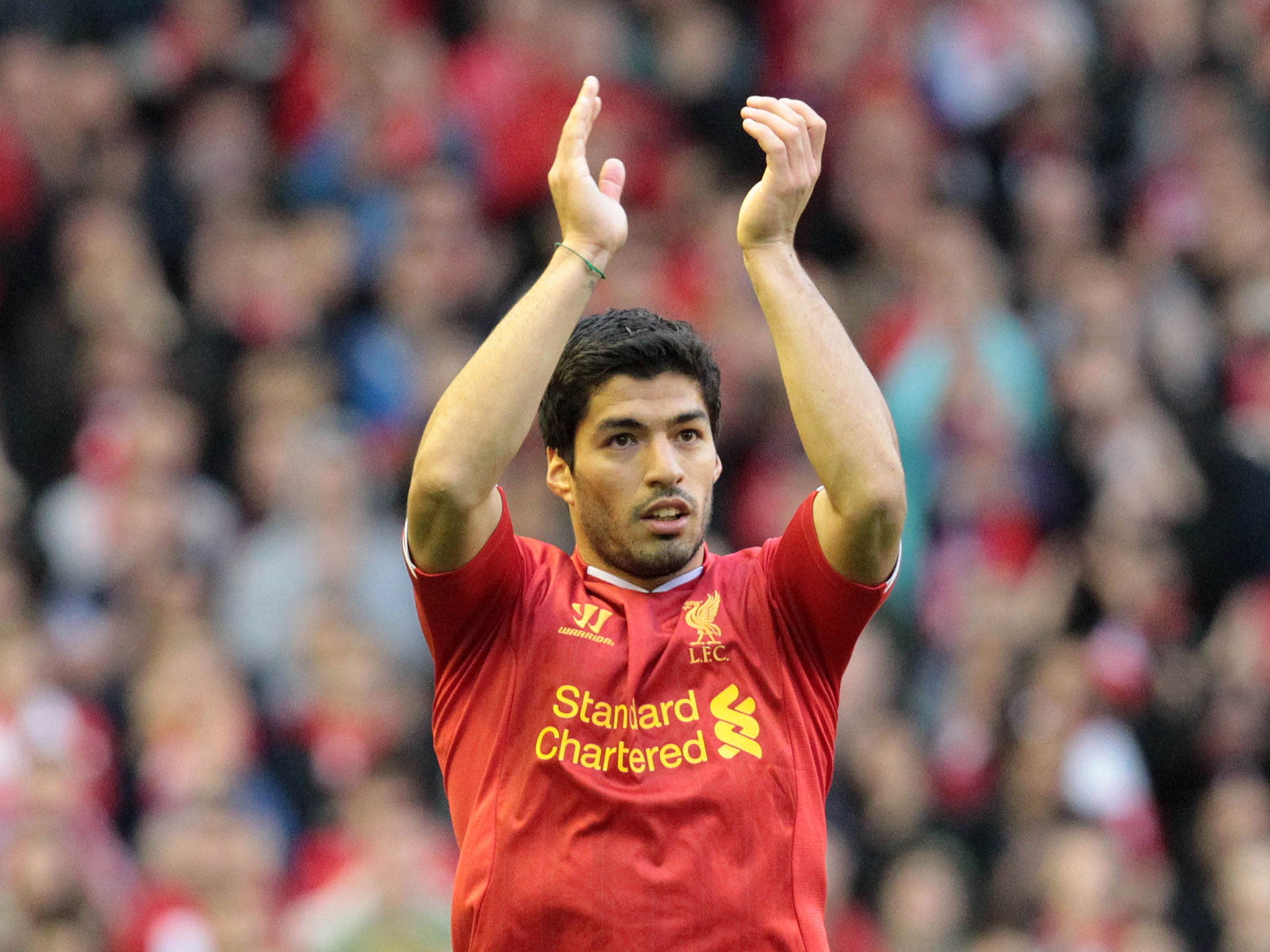 Liverpool manager Brendan Rodgers has claimed Luis Suarez is "as happy as ever"