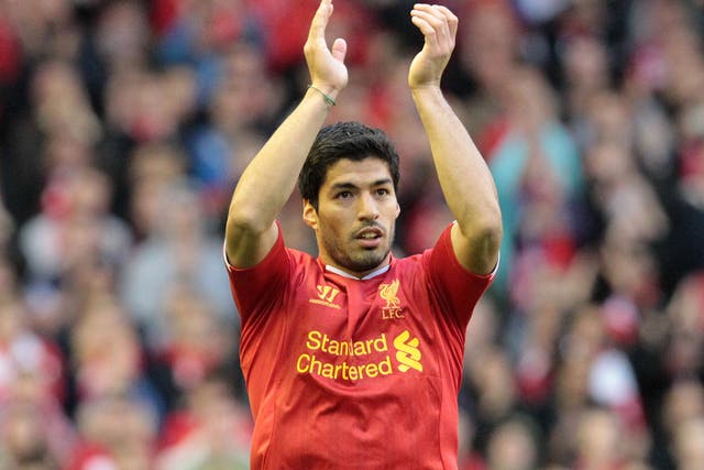 Liverpool manager Brendan Rodgers has claimed Luis Suarez is "as happy as ever"