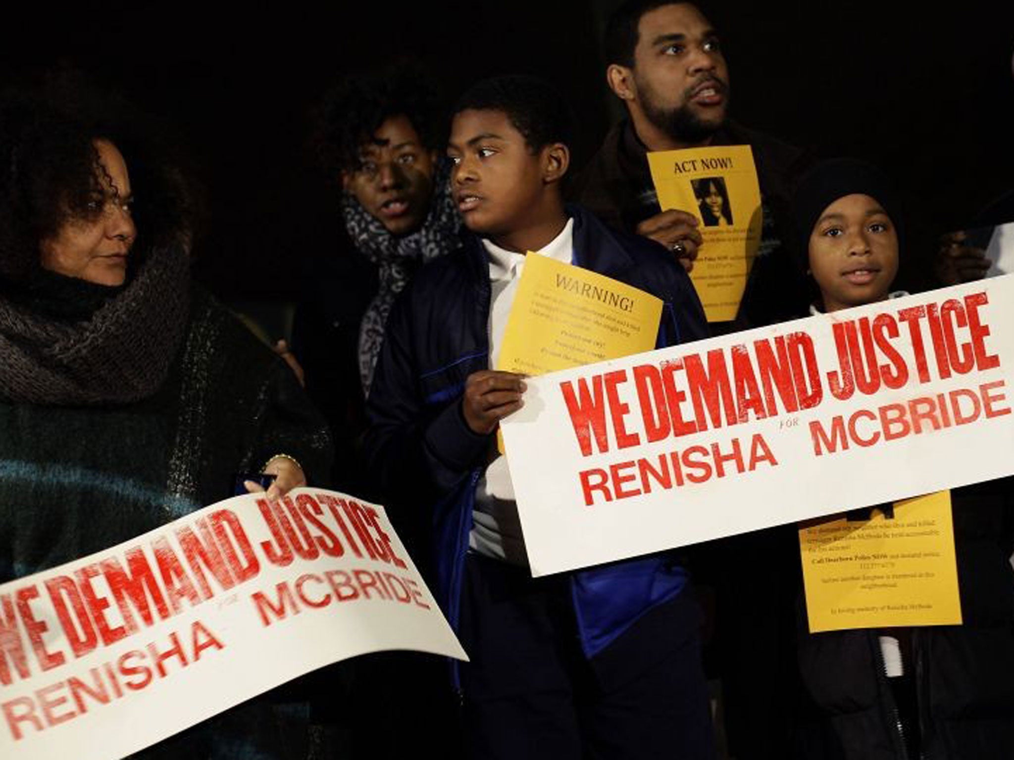 Demonstrators protest against the killing of 19-year-old Renisha McBride outside the Dearborn Heights Police Station in Dearborn Heights, Michigan November 7, 2013.