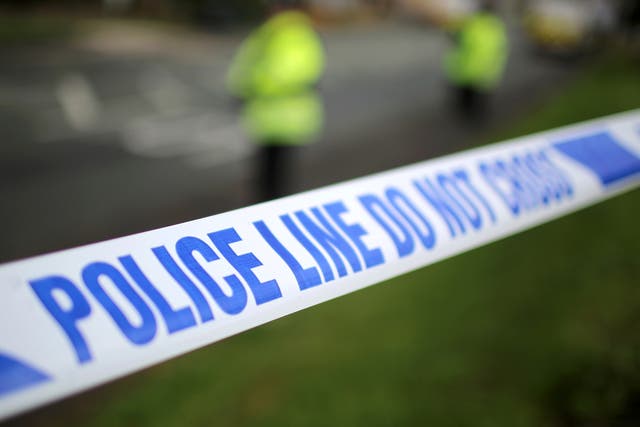 Police say they have arrested a serving British soldier after a 'suspicious device' was found at a home in Salford