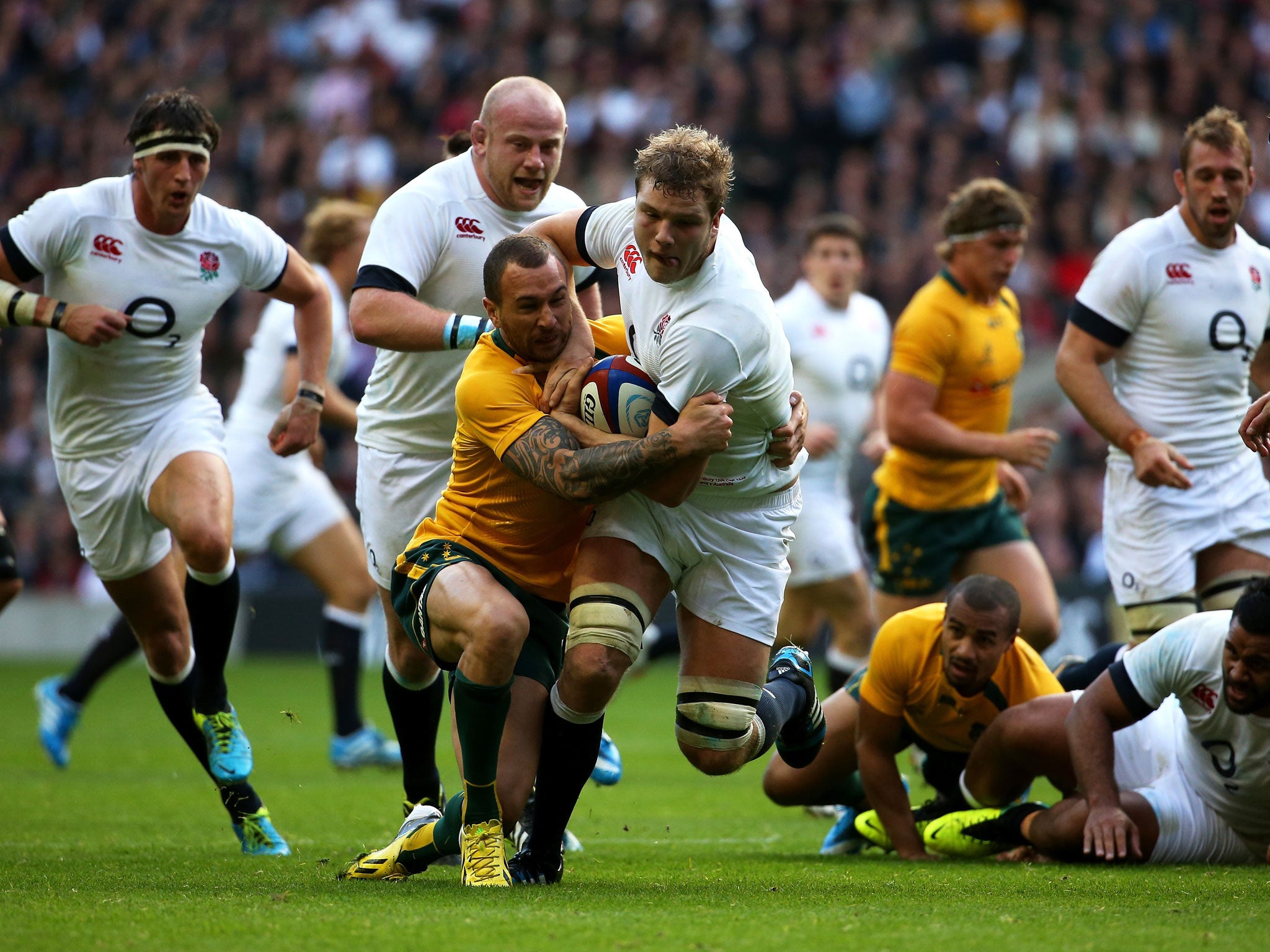 England's Joe Launchbury tussles with Will Genia at Twickenham in a more direct and physical display than hitherto