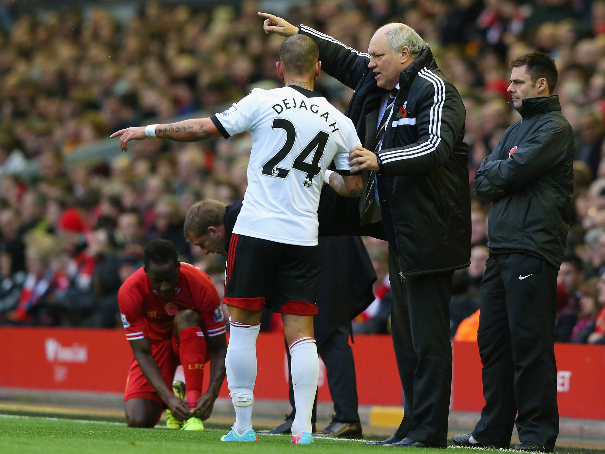 Fulham Manager Martin Jol gives orders to Ashkan Dejagah during the Barclays Premier League match between Liverpool and Fulham at Anfield