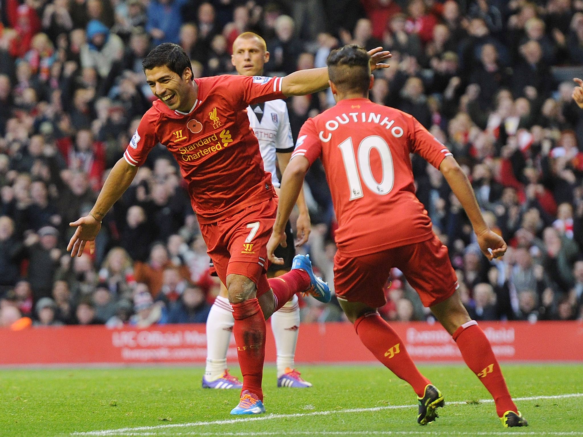 Luis Suarez of Liverpool celebrates his first goal