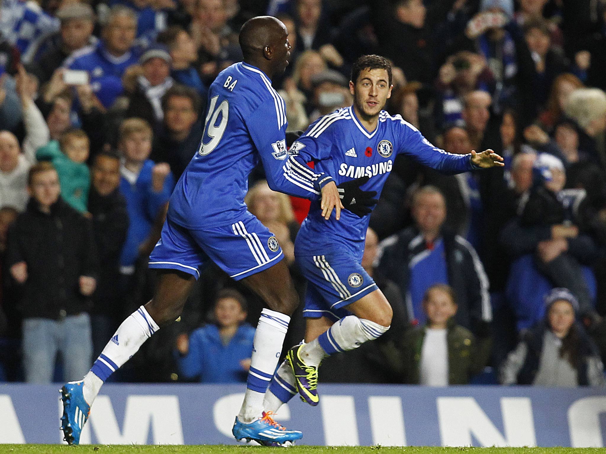 Eden Hazard of Chelsea celebrates with team mate Demba Ba after scoring the equaliser