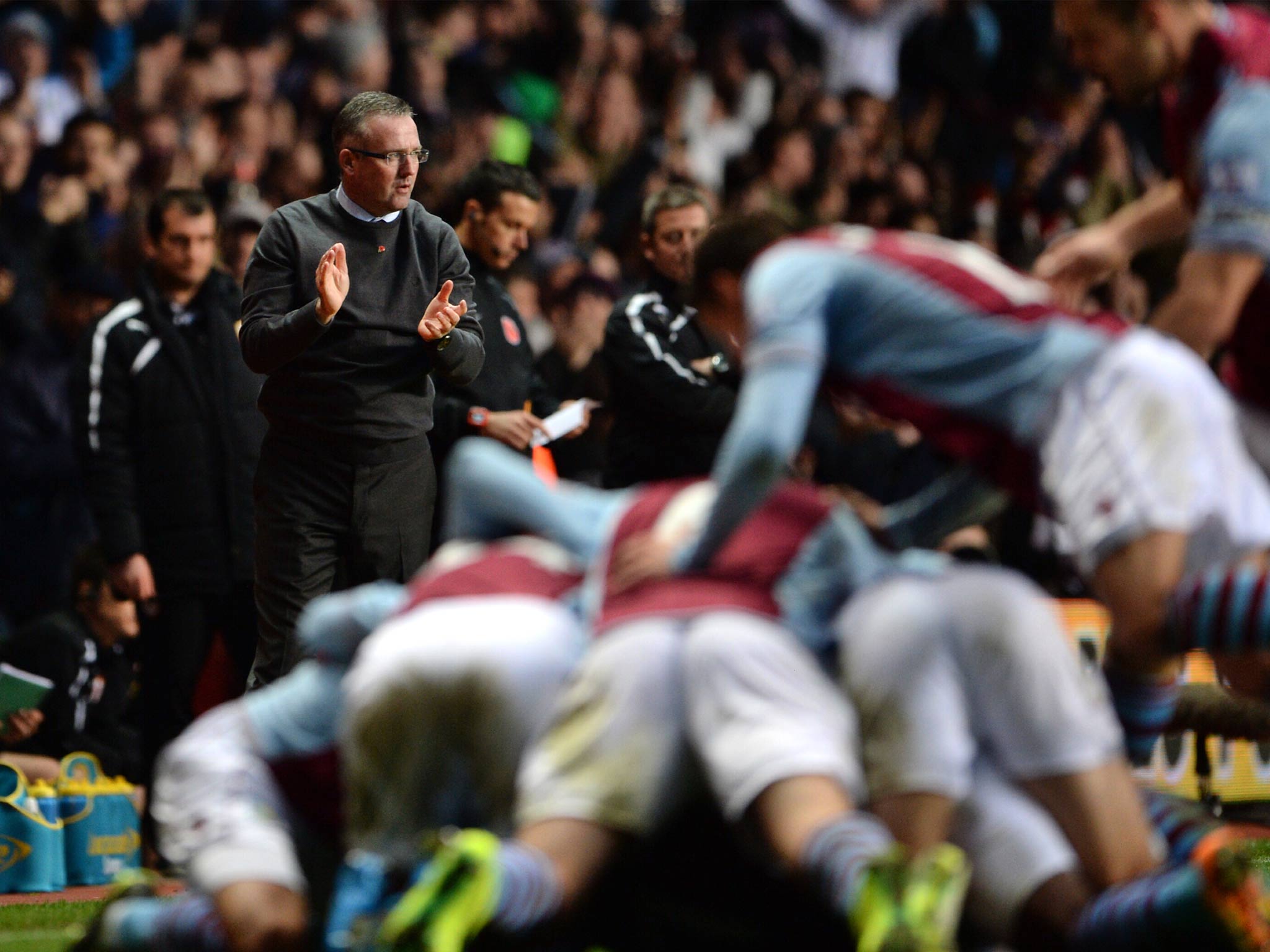 Paul Lambert the Aston Villa manager applauds his players following Leandro Bacuna of Aston Villa opening goal
