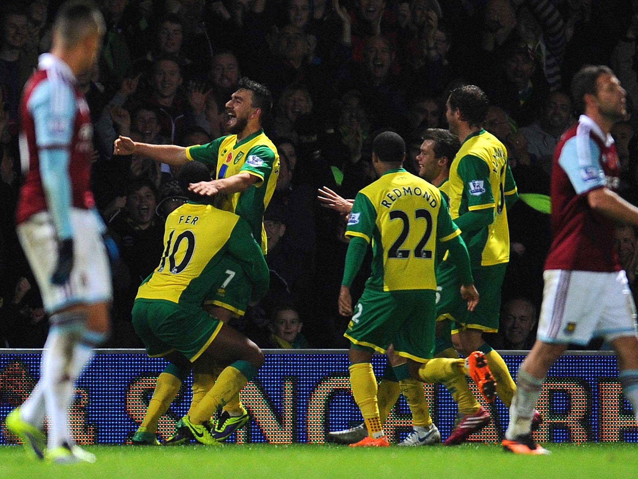 Robert Snodgrass of Norwich City celebrates his goal with Leroy Fer during the Barclays Premier League match between Norwich City and West Ham United at Carrow Road