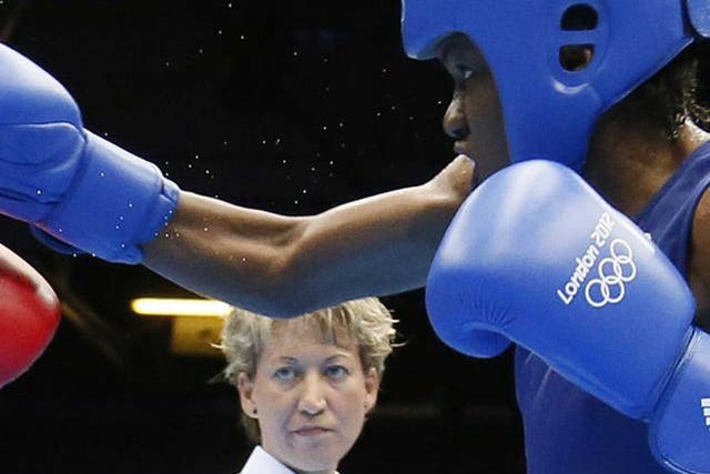 Team GB’s Nicola Adams on her way to the flyweight gold medal against Cancan Ren of China during London 2012