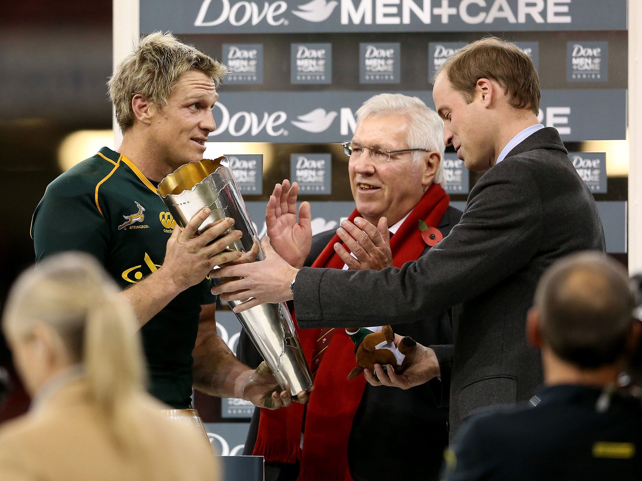 Prince William, Duke of Cambridge hands the trophy to Jean De Villiers of South Africa after the international between Wales and South Africa at Millennium Stadium