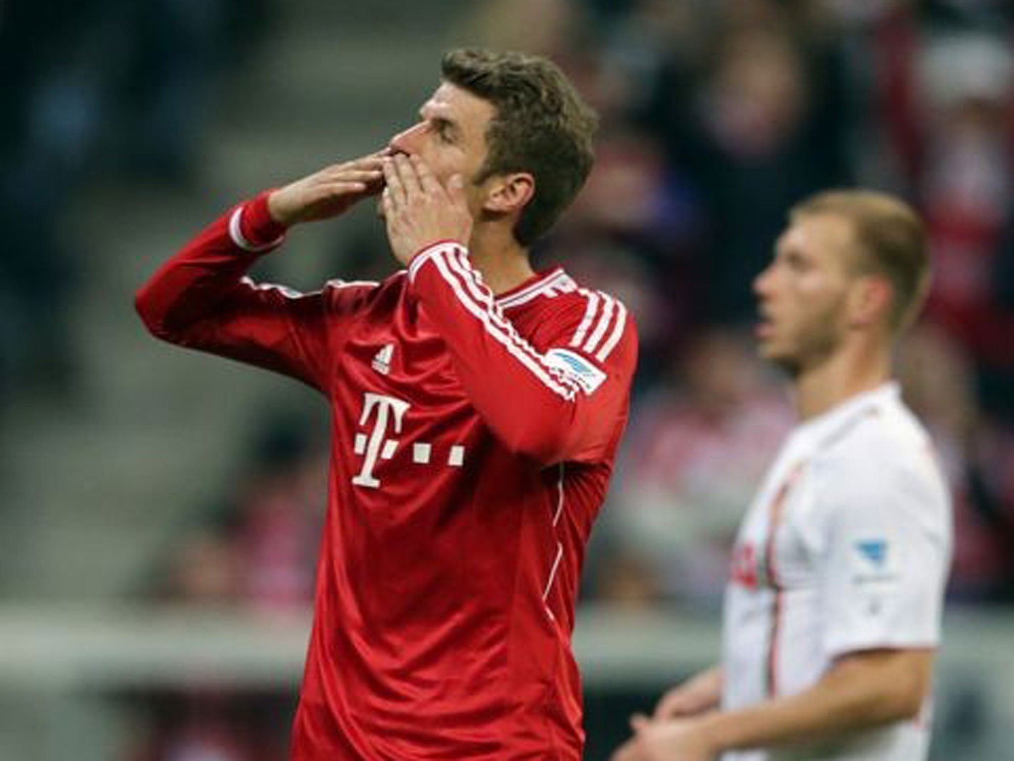 Bayern's Thomas Mueller celebrates after scoring a penalty during the German first division Bundesliga match between FC Bayern Munich and FC Augsburg
