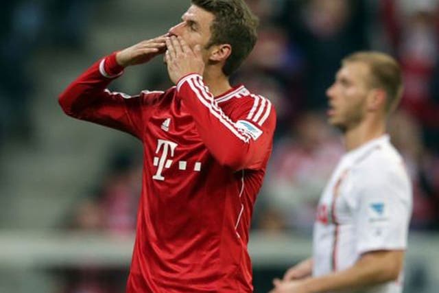 Bayern's Thomas Mueller celebrates after scoring a penalty during the German first division Bundesliga match between FC Bayern Munich and FC Augsburg