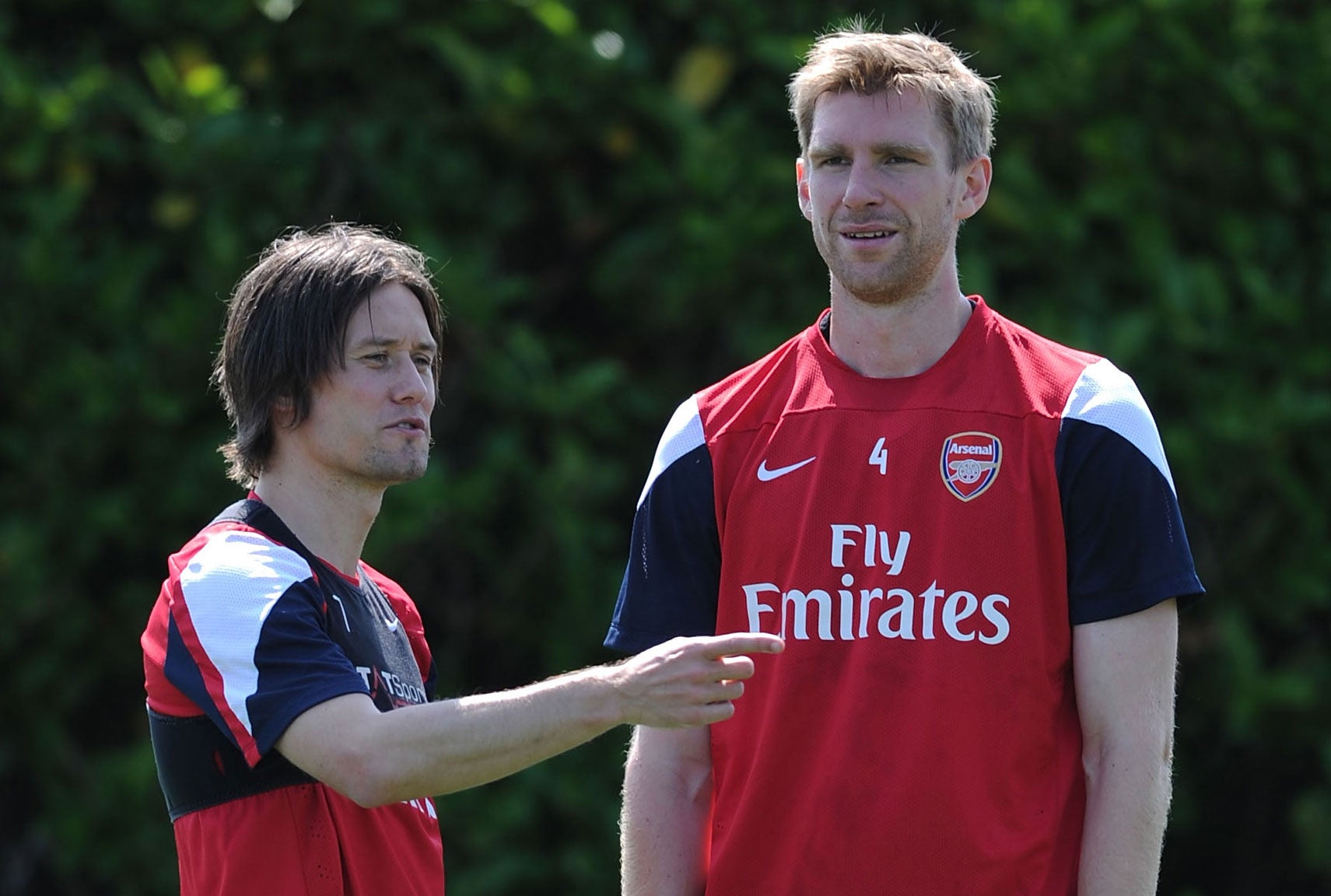 Tomas Rosicky (left) and Per Mertesacker will not feature for Arsenal against Manchester United because of illness