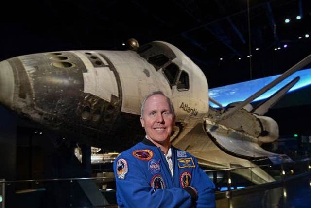 Walk this way: astronaut Tom Jones in front of a space shuttle. He was on four space shuttle missions and completed three space walks