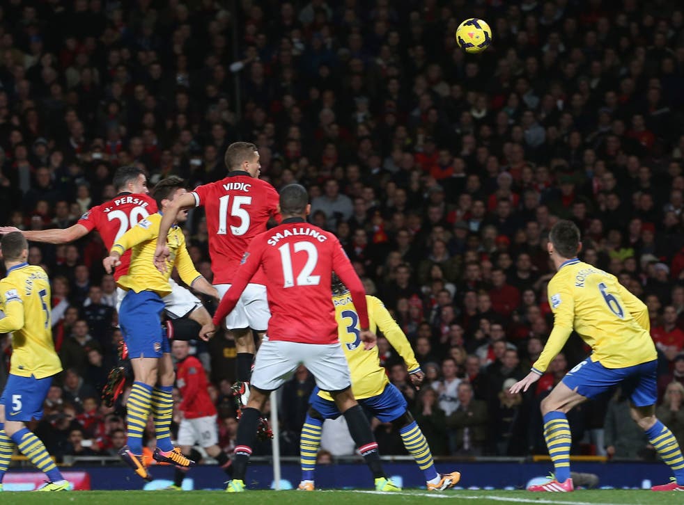 Robin van Persie rises to meet Wayne Rooney's corner to score the only goal of the match