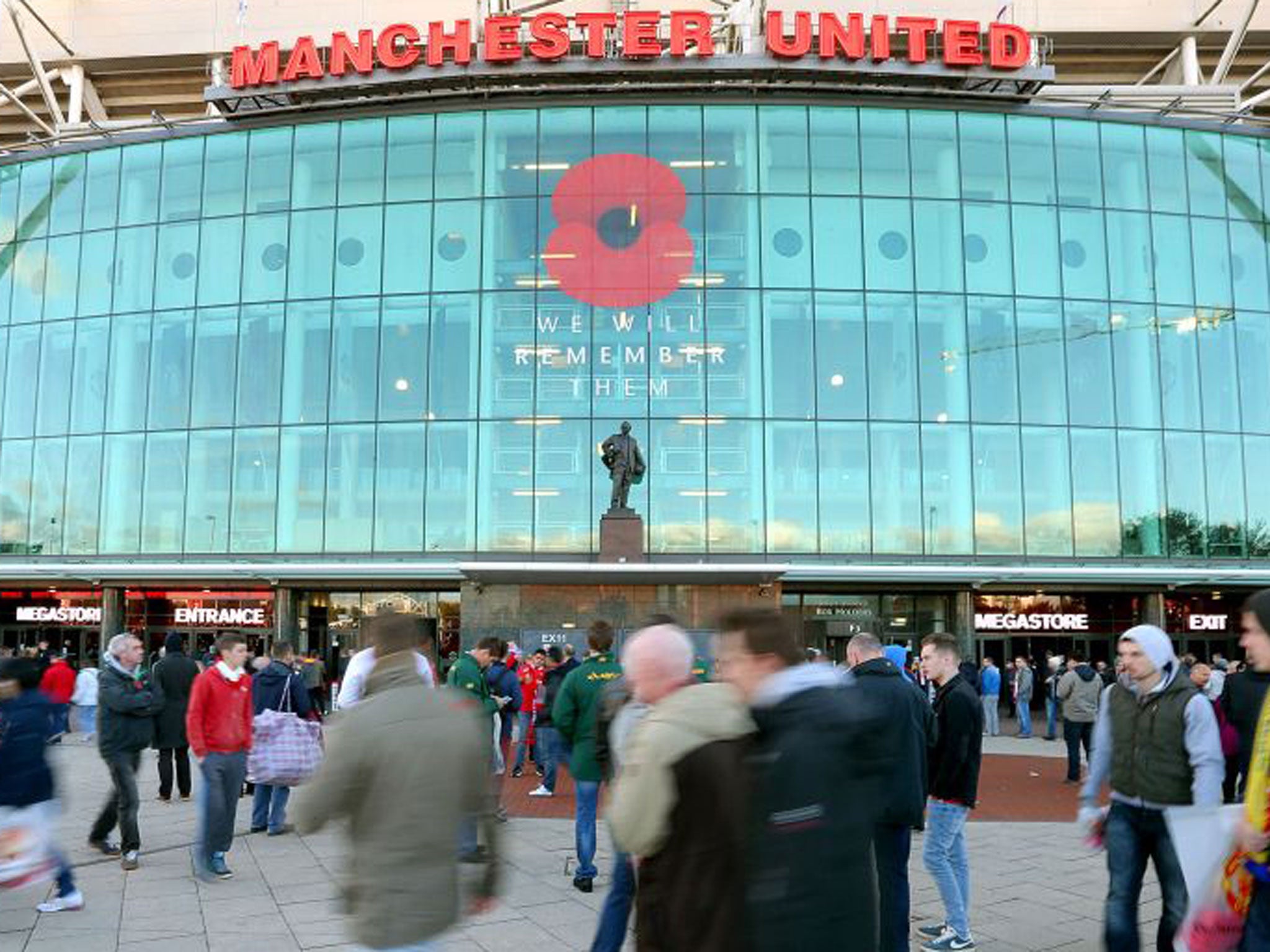 The supporters enter Old Trafford on Remembrance Sunday