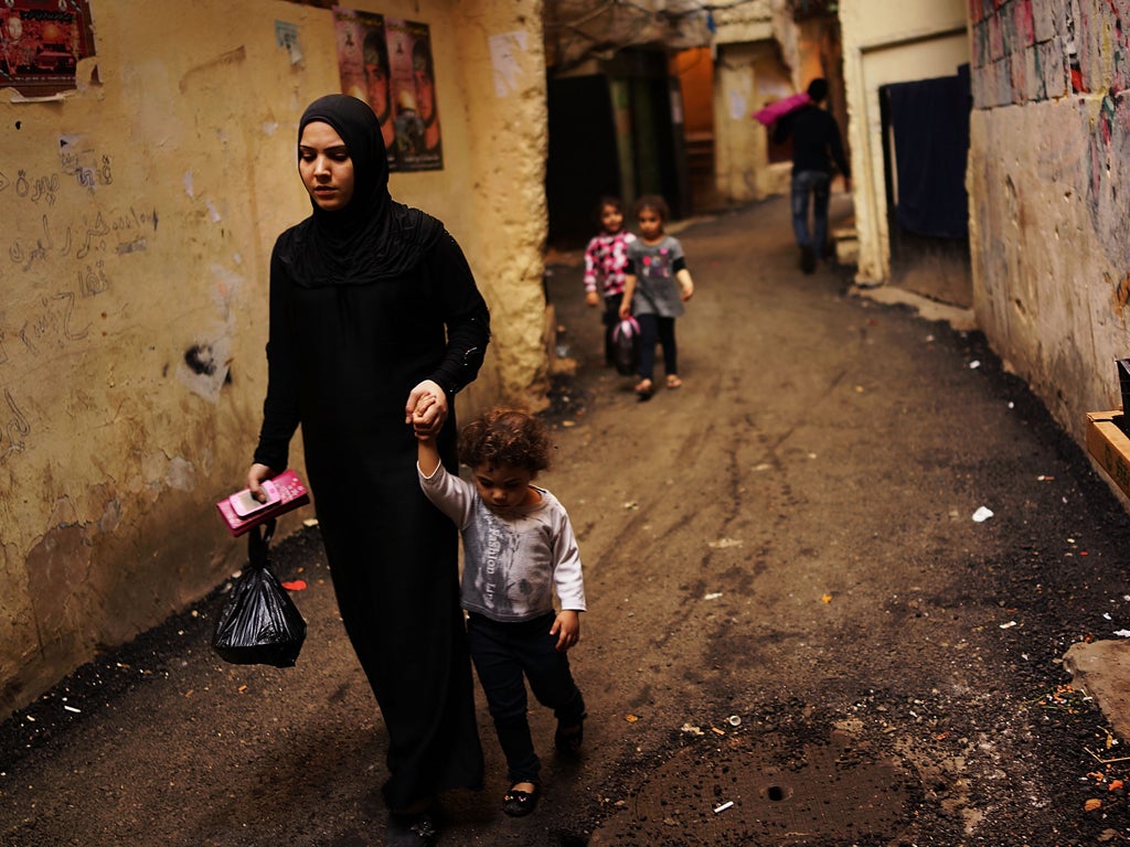 A Syrian woman and her child in Beirut