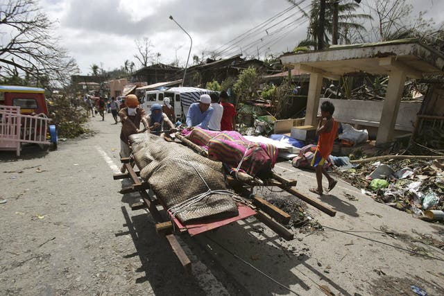 Bodies are taken out of Tacloban