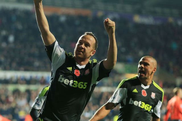 Charlie Adam celebrates his dramatic injury-time penalty against Swansea