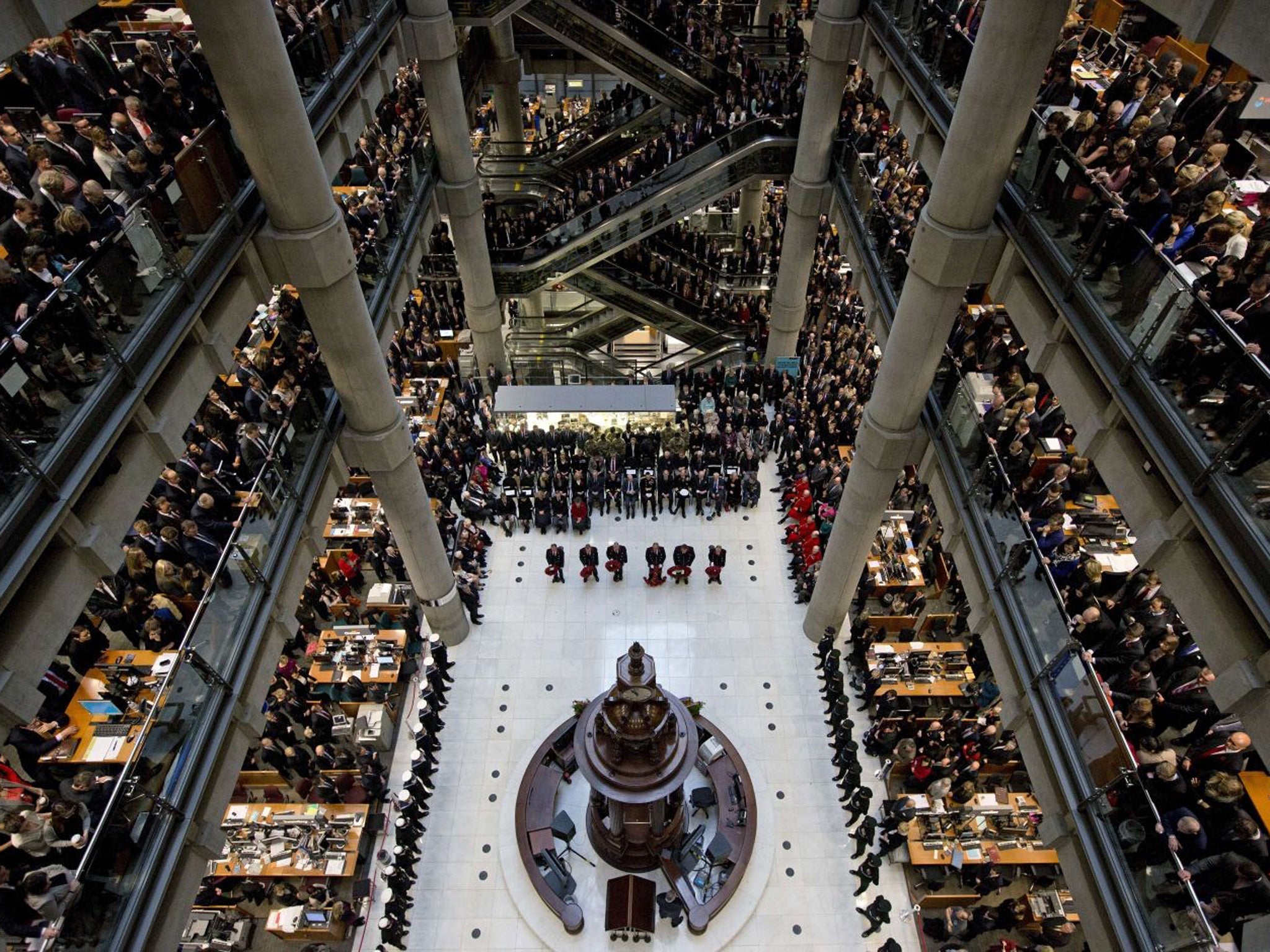 Brokers and underwriters line the balconies and escalators of the Lloyd's of London building in central London