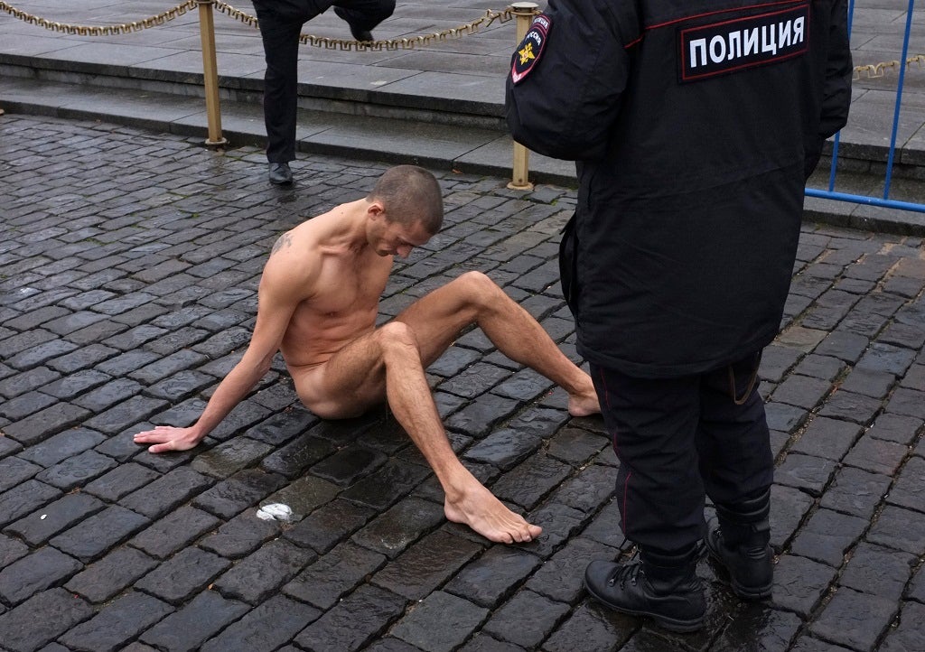 Pyotr Pavlensky nails his genitals to the pavement as "a metaphor for apathy"