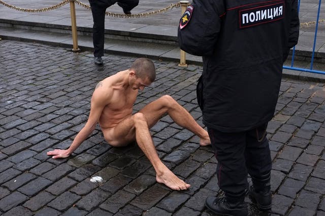 Pyotr Pavlensky nails his genitals to the pavement as "a metaphor for apathy"
