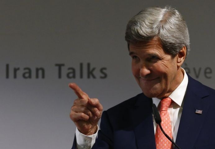 The US Secretary of State John Kerry gestures during a news conference after nuclear talks in Geneva