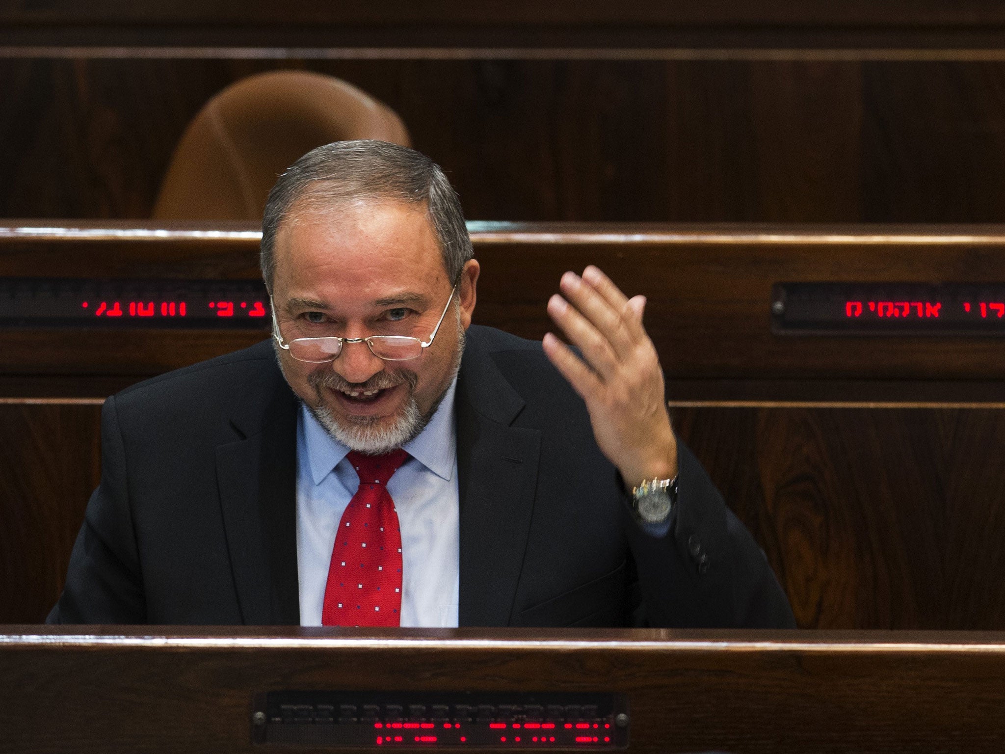 Avigdor Lieberman smiles before he is sworn in as the Israeli foreign minister