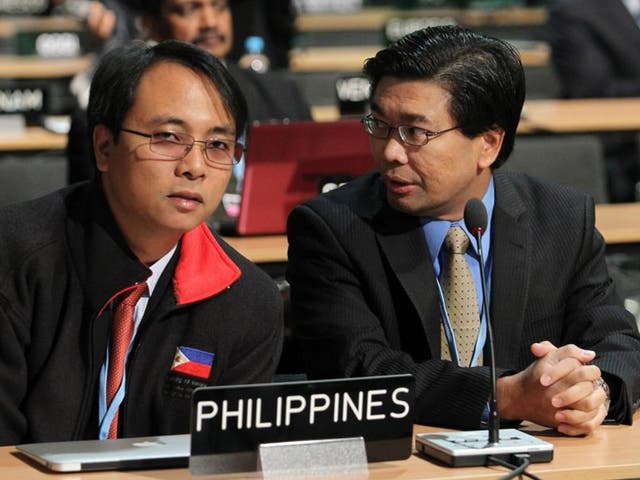 Filipino delegates Naderev Sano, left, and Vicente Paolo Yu III