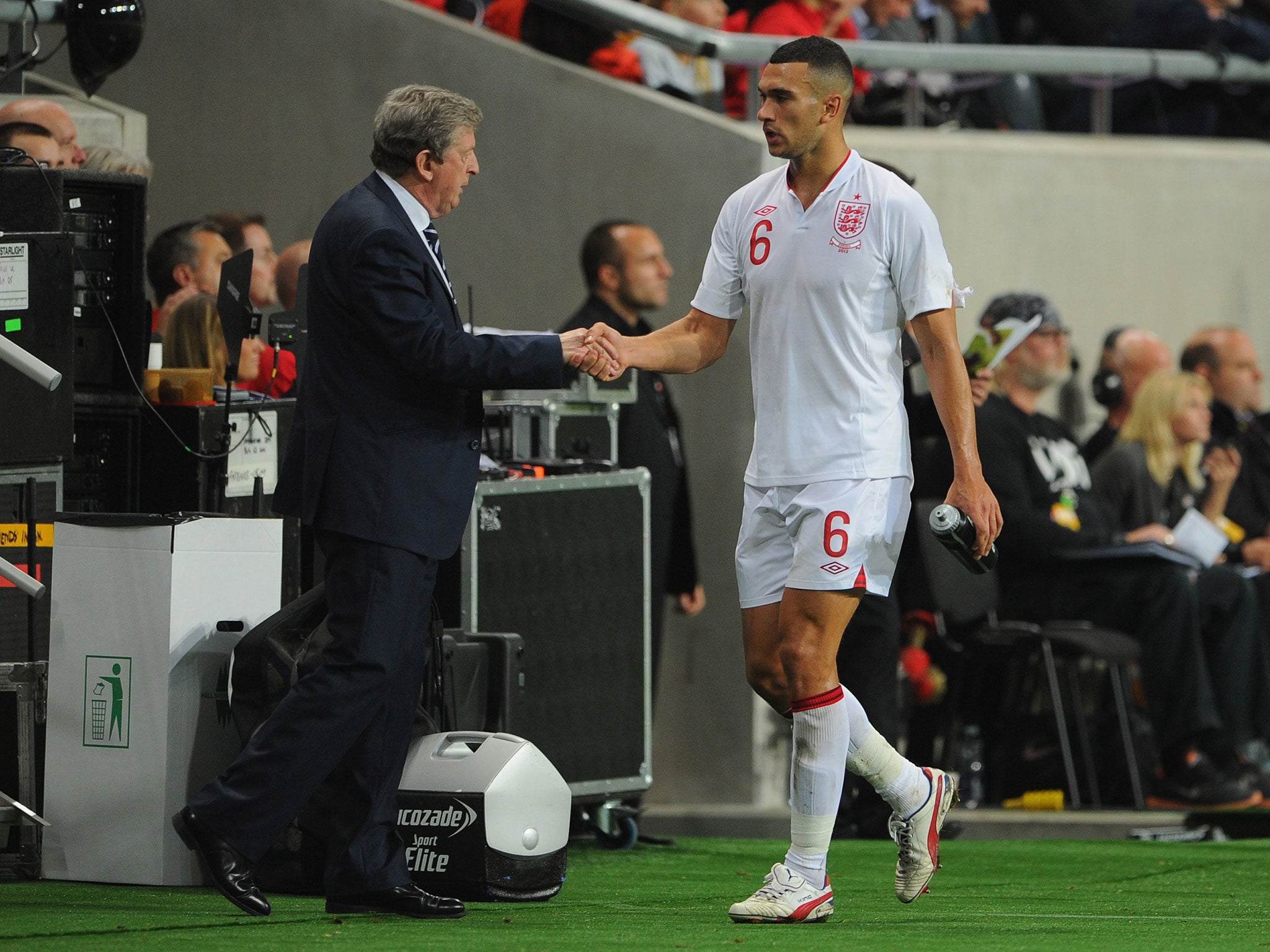 Steven Caulker shakes hands with England manager Roy Hodgson after making a goalscoring debut against Sweden