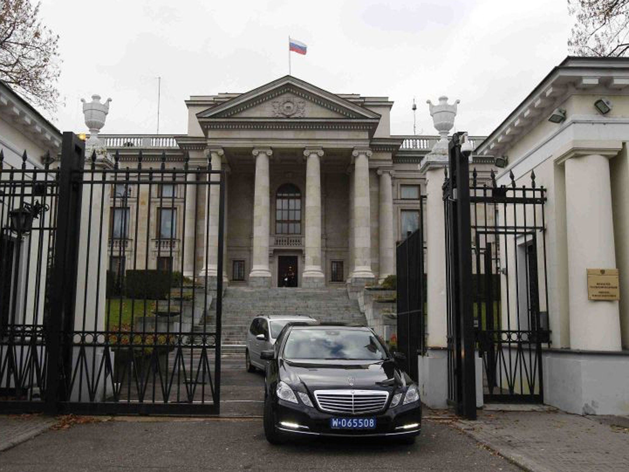 Cars leaving the Russian embassy on Tuesday morning