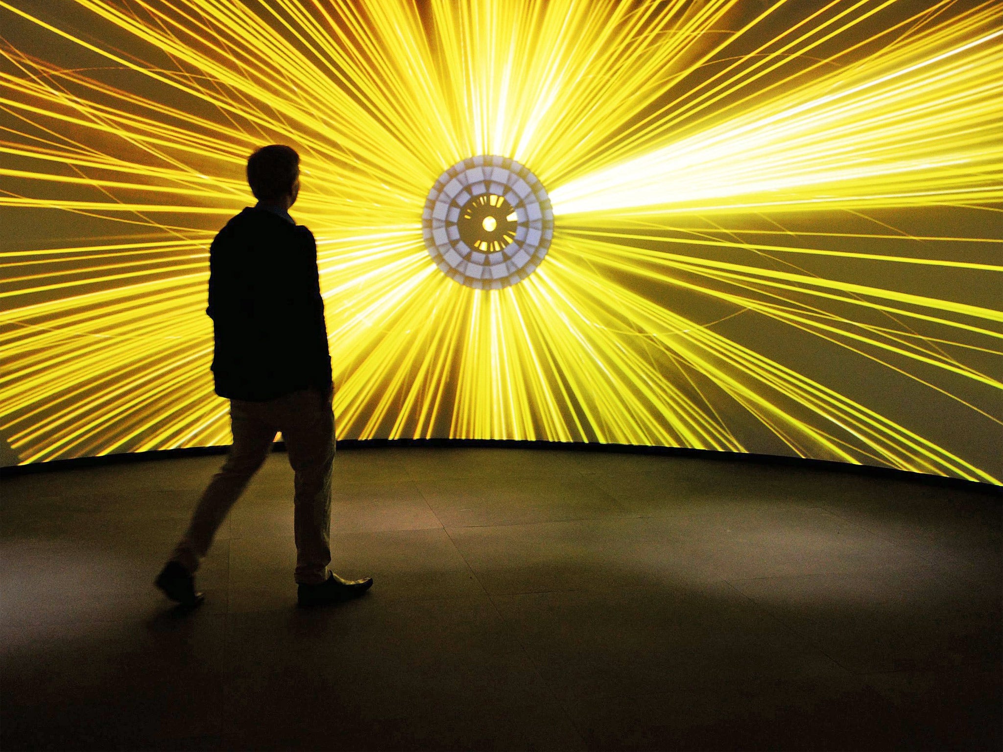 A visitor attends the Large Hadron Collider exhibition at Science Museum in London