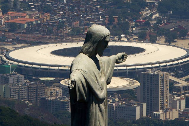 An aerial view of the Christ The Redeemer statue (F) and the venue for the final - the Maracana Stadium