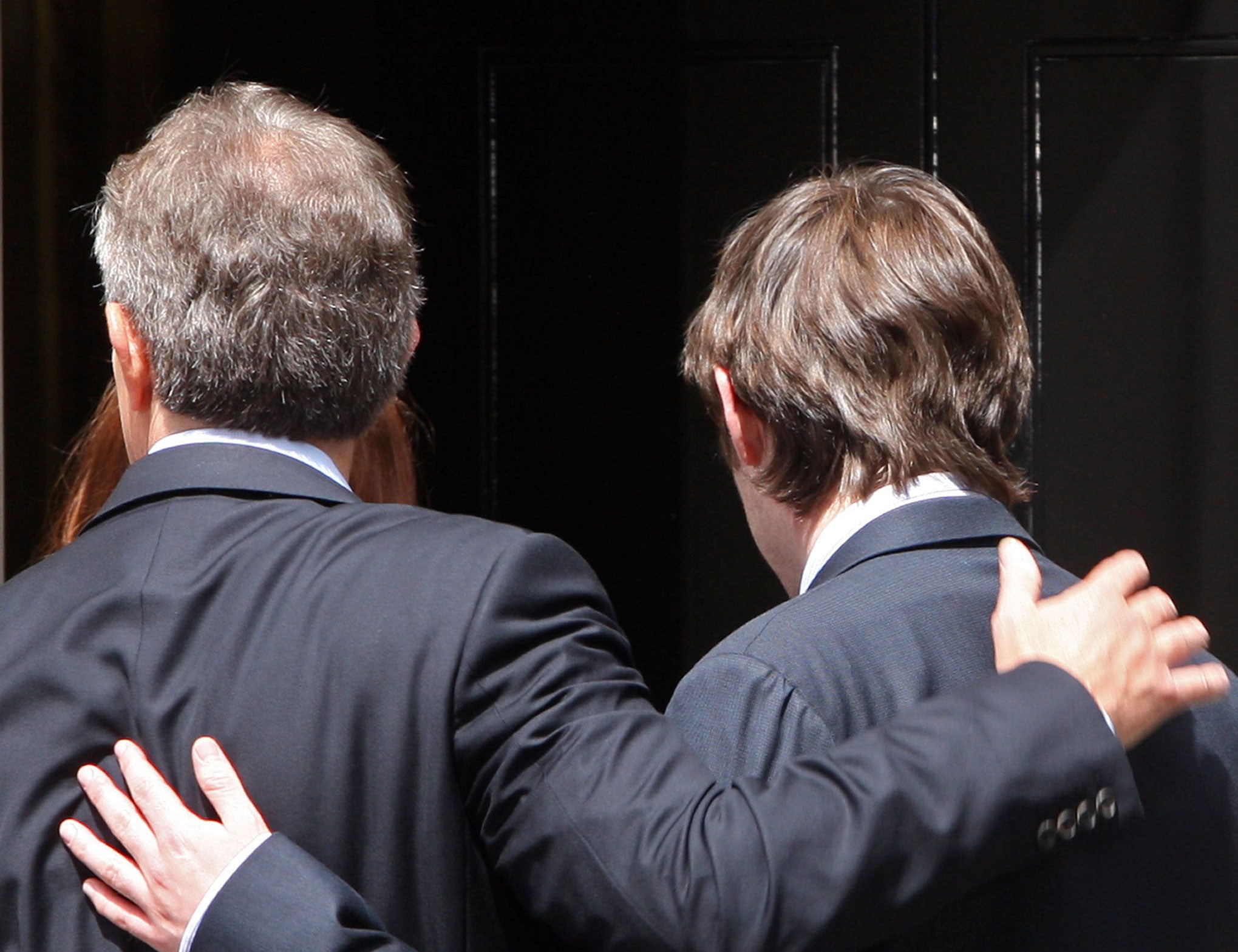 Tony Blair embraces his son Nicky as he walks out of Downing Street for the last time in June 2007