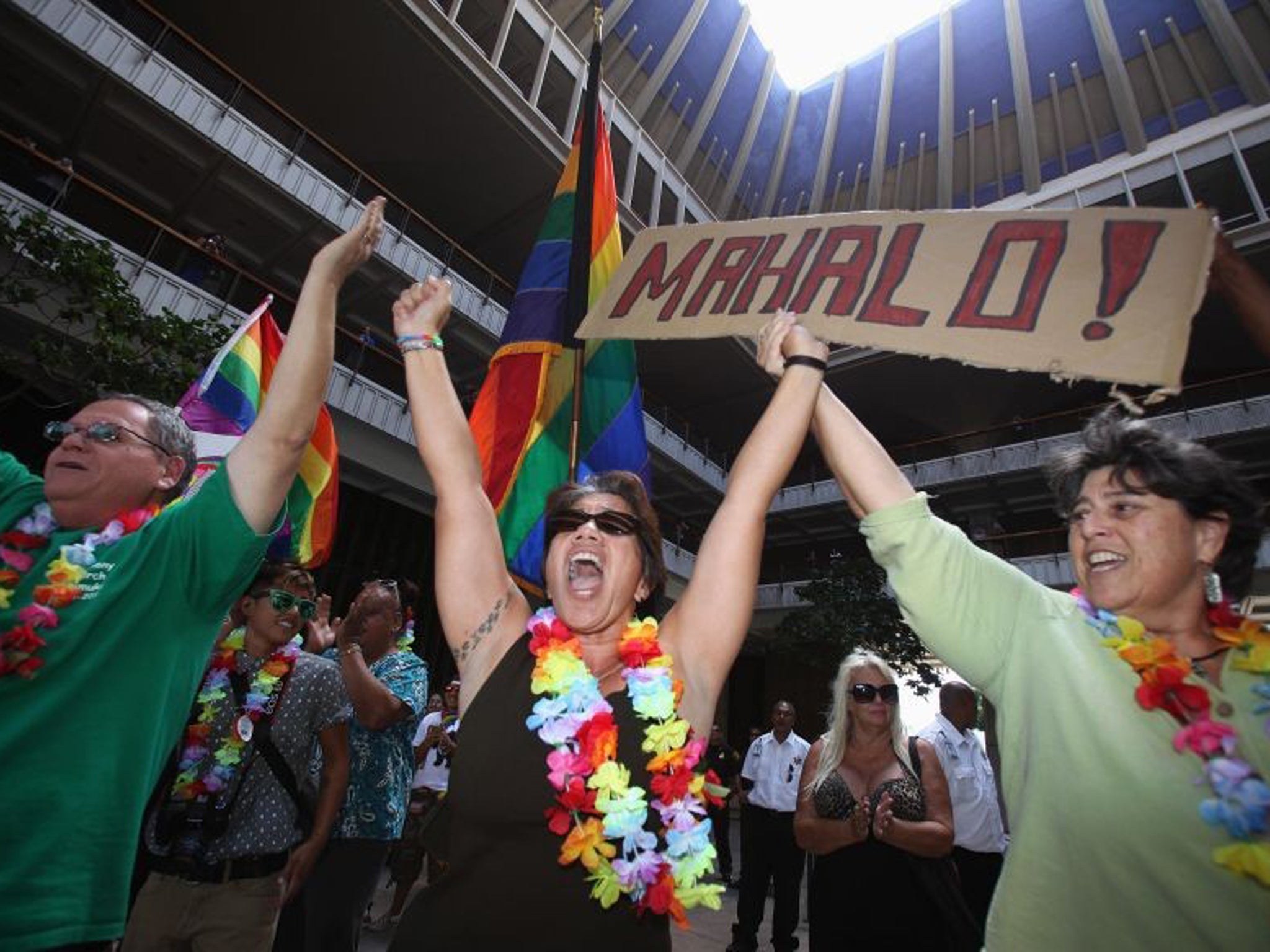 People celebrate in Honolulu after the Hawaii State Senate approved a bill allowing same-sex marriage to be legal in the state of Hawaii