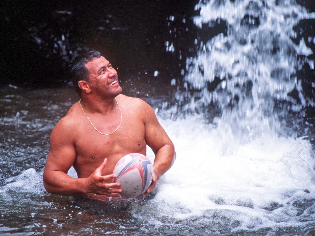 Fatialofa cools off under a waterfall in the run-up to a game against a touring Wales side in 1994