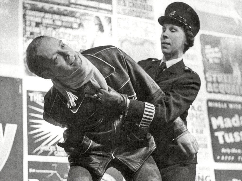 Hicks arrests a juvenile delinquent in ‘The Lily White Boys’ at London’s Royal Court in 1960