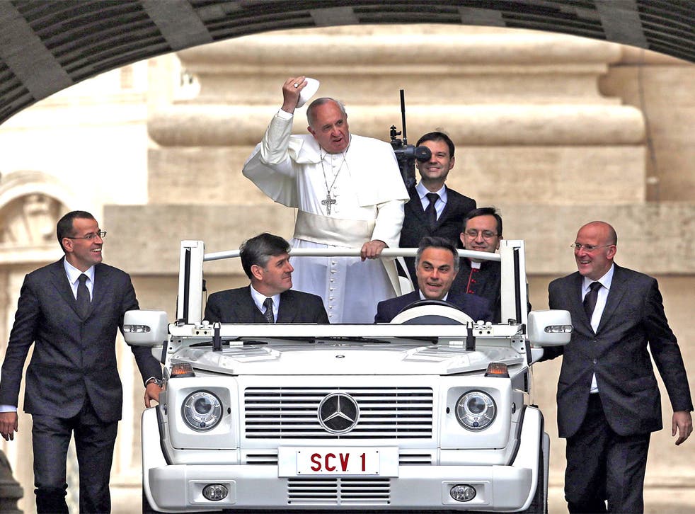 Pope Francis arrives to conduct his weekly general audience at St. Peter's Square
