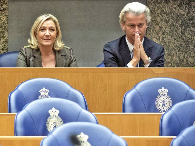 Marine Le Pen, leader of the French National Front, sits next to Dutch leader of the Party for Freedom (PVV) Geert Wilders, at The Hague