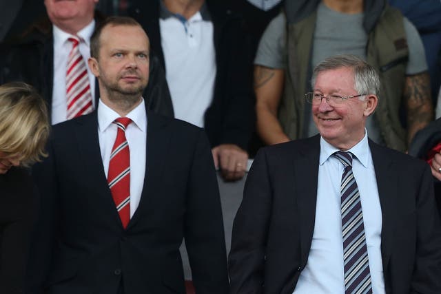 Manchester United executive vice-chairman Ed Woodward stands alongside former manager Sir Alex Ferguson
