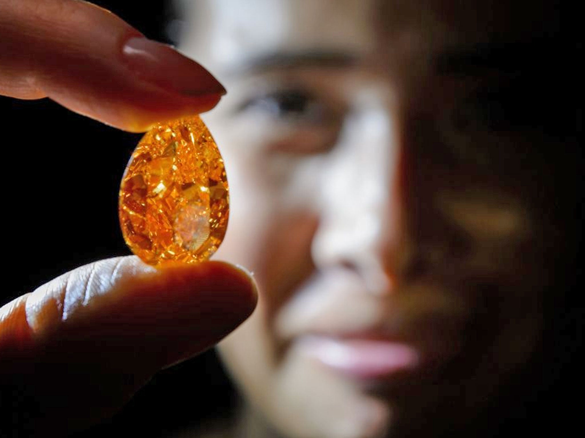 A rare, orange,14.82 carat diamond called The Orange has sold for nearly 36 million dollars at an auction in Geneva